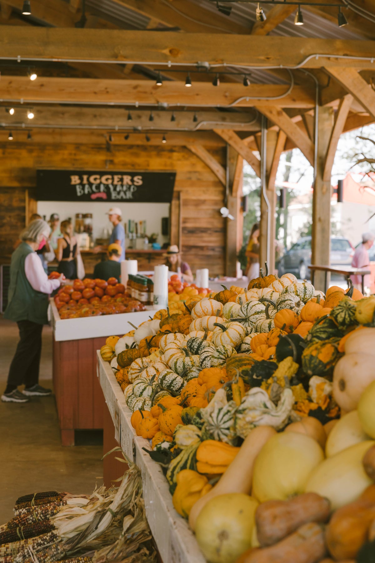 A customer holding fresh produce at Biggers Market