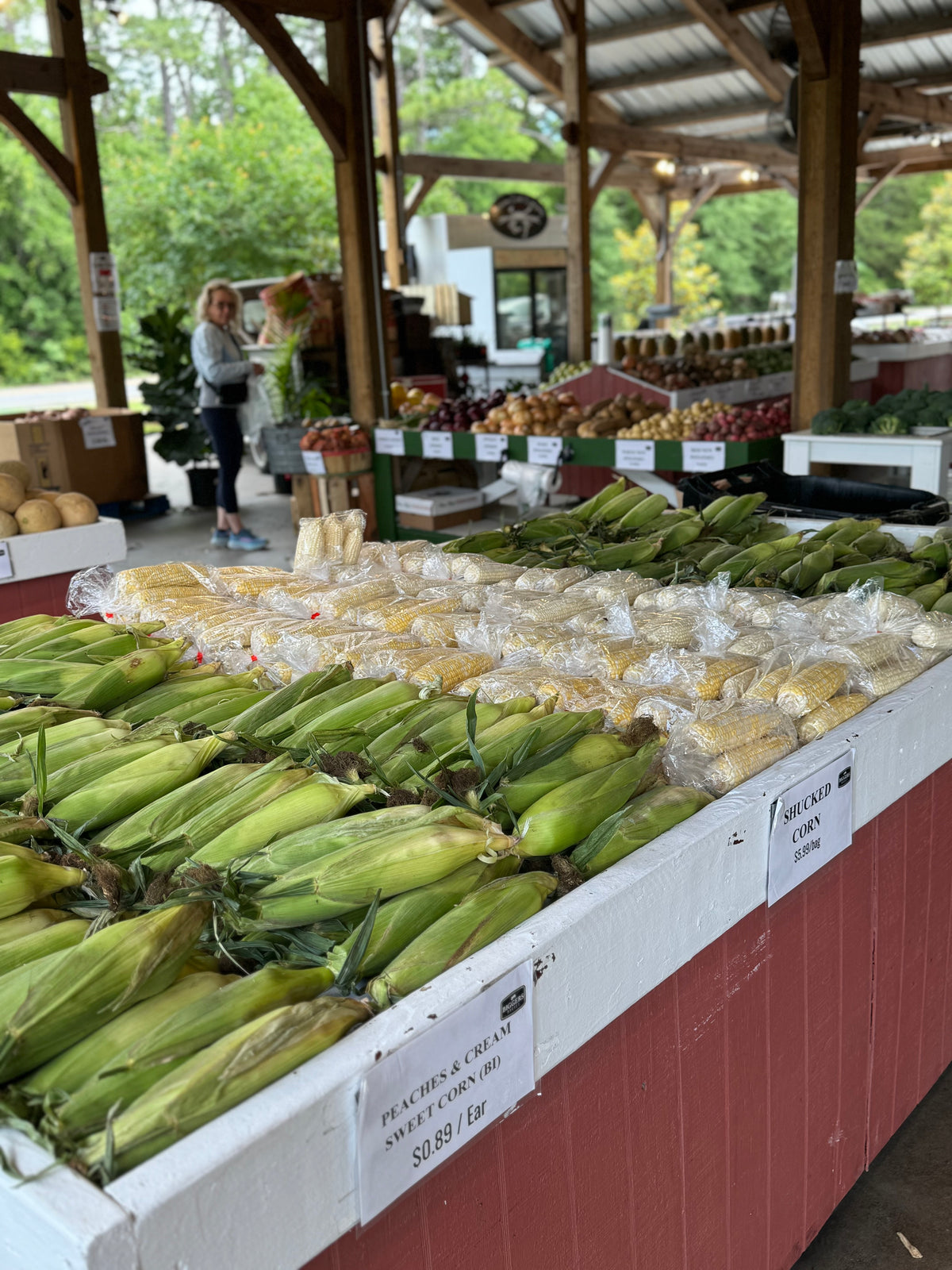 A lively open-air produce market filled with seasonal food and flowers