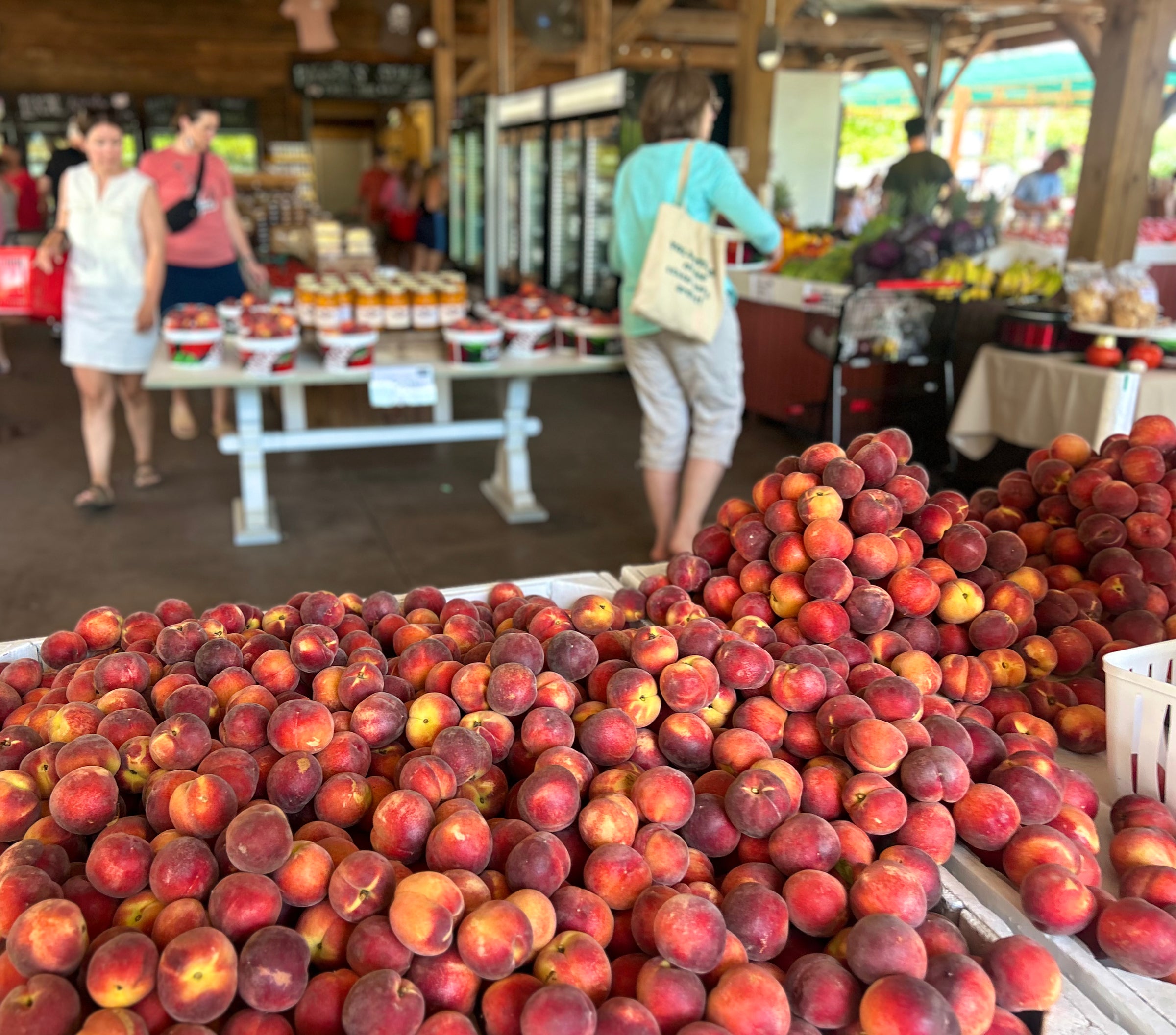 Customer shopping among fresh produce at Biggers Market