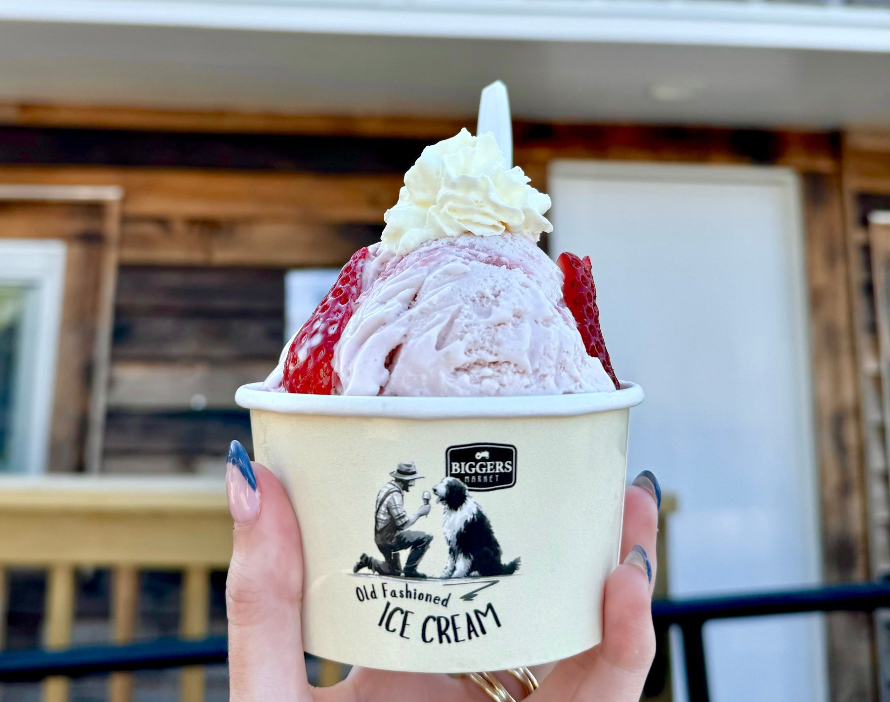 A generous scoop of homemade Biggers ice cream in a waffle cone